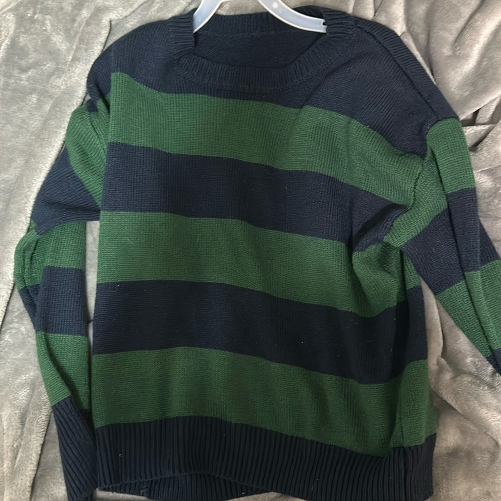 Green and blue striped sweater